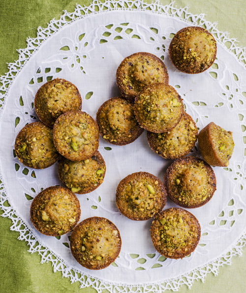 Pistachio and lemon friands on a patterned lace doily